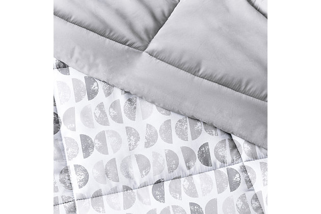 The perfect comforter to keep you cozy all year round. The Down Alternative Moonlight Stars Patterned reversible comforter set from the Home Collection features the perfect loft and Down-like feel to keep you warm and toasty while you sleep. Designed for healthy living and 100% hypoallergenic for allergy sufferers, this luxury comforter presents a quality alternative to Down with incredible loft and end to end baffle-box construction, preventing fiber from shifting, eliminating the need for regular fluffing.Twin Size Set Includes: 1 Comforter: 70" x 90", 1 Standard Sham: 20" x 26" (2" flange) | Light-weight shell for exceptional softness and drape | Generous baffle box stitching for optimum loft | Printed Moonlight Stars pattern reverse to Light Gray | Evenly filled for superior warmth | Imported