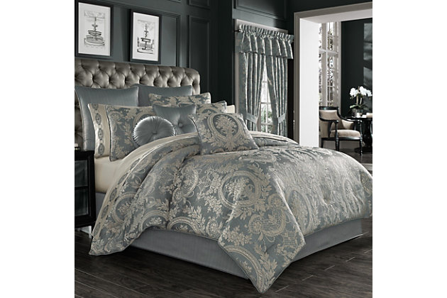 The Nicolette 4-Piece Comforter Set includes a luxury quilted comforter, two pillow shams and a bed skirt. Smooth to the touch and finished with a satin cord, the comforter combines a beautiful blue-toned stria with a dramatically framed medallion. It's made with a one-of-a-kind puff jacquard technique, adding unique dimension to the top of the bed. It's finished with circle quilt stitching, and the bed skirt is tailored with corner kick pleats made from the coordinating satin fabric. The set's two shams feature floral medallions, reverse to a solid blue and are finished with satin cording. Pair with the Nicolette bedding collection by J. Queen New York to complete the look.Made of 100% polyester | Soft polyfill | Set includes 1 quilted comforter, 2 pillow shams, and 1 bed skirt with corner kick pleats | Made with design house-quality fabric and craftsmanship | Timeless take on traditional patterns with an updated color palette | Blue-toned stria satin with medallion on front of comforter | Comforter has puff jacquard technique for added dimension; finished with circle quilt stitching | Shams feature floral medallions, reverse to solid blue and are finished with satin cord detail | Imported | Dry clean only | Pair with the  nicolette collection euro sham, throw pillows, and window treatments by j. Queen new york (sold separately) to complete the look