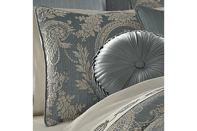 The Nicolette 4-Piece Comforter Set includes a luxury quilted comforter, two pillow shams and a bed skirt. Smooth to the touch and finished with a satin cord, the comforter combines a beautiful blue-toned stria with a dramatically framed medallion. It's made with a one-of-a-kind puff jacquard technique, adding unique dimension to the top of the bed. It's finished with circle quilt stitching, and the bed skirt is tailored with corner kick pleats made from the coordinating satin fabric. The set's two shams feature floral medallions, reverse to a solid blue and are finished with satin cording. Pair with the Nicolette bedding collection by J. Queen New York to complete the look.Made of 100% polyester | Soft polyfill | Set includes 1 quilted comforter, 2 pillow shams, and 1 bed skirt with corner kick pleats | Made with design house-quality fabric and craftsmanship | Timeless take on traditional patterns with an updated color palette | Blue-toned stria satin with medallion on front of comforter | Comforter has puff jacquard technique for added dimension; finished with circle quilt stitching | Shams feature floral medallions, reverse to solid blue and are finished with satin cord detail | Imported | Dry clean only | Pair with the  nicolette collection euro sham, throw pillows, and window treatments by j. Queen new york (sold separately) to complete the look