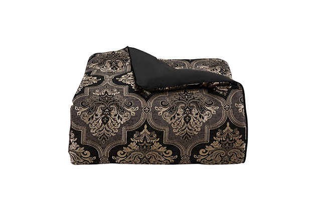 The Windham 4-Piece Comforter Set is constructed with a framed woven damask fabric in chenille black and graphite to add opulence to your bedroom decor. The luxe comforter features circle quilt stitching and is finished with bold black piping. This oversized set is truly stunning and will bring lasting comfort and compliments. The set also includes two matching pillow shams and a bed skirt. Pair this collection with the Windham throw pillows, Euro shams and window treatments by J. Queen New York to complete the look.Made of 100% polyester | Soft polyfill | Set includes 1 oversized comforter, 2 pillow shams and 1 bed skirt | Damask fabric in chenille black and graphite | Comforter features circle quilt stitching;  finished with black piping | Made with design house-quality fabric and craftsmanship | Timeless take on traditional patterns with an updated color palette | Imported | Dry clean only | Pair with the windham throw pillows, euro shams and window treatments by j. Queen new york (sold separately) to complete the look