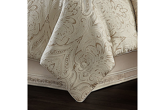 The Trinity 4 Piece Comforter Set is luxurious and beautifully crafted with a woven damask jacquard fabric in lovely tones of champagne. The damask pattern features a light champagne outline to give a unique three-dimensional look. Paired with matching pillow shams with hidden zippers and a solid champagne split-corner bed skirt with a 3 inch decorative woven jacquard stripe border along the bottom edge, this oversized ensemble will add a statement to your bedroom decor. The comforter is finished with a champagne piping for added detail. Coordinate window treatments, shams, and throw pillows are also available and sold separately to complete the look.Comforter Set Includes: 1 Comforter, 2 Pillow Shams, 1 Bedskirt. | Made with design house quality fabric and craftsmanship. | Timeless take on traditional patterns with an updated color palette. | Pair this Trinity bedding collection with the Euro Sham, Throw Pillows, and Window Treatments by J. Queen for a complete look.