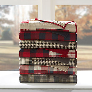 The Woolrich Sunset quilted throw features a mix and match of plaids and solids, and reverses to a solid. Made from cotton, this lightweight throw is soft to the touch and can be used year-round.Made of 100% cotton | Plaid print; solid reverse | Quilted | Machine washable | Imported