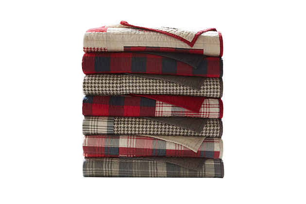The Woolrich Sunset quilted throw features a mix and match of plaids and solids, and reverses to a solid. Made from cotton, this lightweight throw is soft to the touch and can be used year-round.Made of 100% cotton | Plaid print; solid reverse | Quilted | Machine washable | Imported
