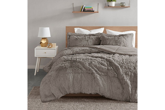 Stay warm and cozy with the Intelligent Design Malea Shaggy Faux Fur Comforter Set. The grey faux fur comforter features a soft shaggy texture to add to your bedroom decor. The soft plush on the reverse provides extra warmth and comfort, while matching sham(s) complete the faux fur comforter set. Hypoallergenic polyester fills the comforter with more weight than the common comforter. Machine washable for easy care, this shaggy faux fur comforter set offers the ultimate warmth to your bedroom decor. Set includes: 1 comforter and 2 shams (1 sham for Twin sizes).Imported | Stylish shaggy faux fur texture | Soft & warm plush reverse | Hypoallergenic polyester filling in the comforter | Overfilled for maximum coziness | Oeko-Tex Certified, no harmful substances or chemicals (#SH025 144503) | Set includes comforter and two matching shams (1 in Twin/Twin XL) | Machine washable