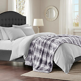 The Madison Park Zuri oversized throw features luxuriously soft faux fur and reverses to a solid faux mink. This chic throw has a modern feel, adding a cozy yet glam accent to your bed.Made of polyester | Machine washable | Imported