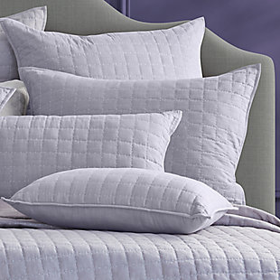 The Caspian quilt set offers a tonal touch of dusky lavender to reshape your space into a relaxing retreat. The medium-weight quilt is great on its own or layered and is constructed with box quilting, using a thick running stitch in coordinating grey yarns, which is inspired by the Kantha technique. The 100% cotton fabric has a very soft linen-like hand which gets softer over time, making it a timeless addition to your home decor. The included shams are quilted with matching stitching to complete this soothing ensemble.Set includes: quilt and pillow sham | Made of 100% cotton | Soft polyfill | Machine washable or spot clean | Imported