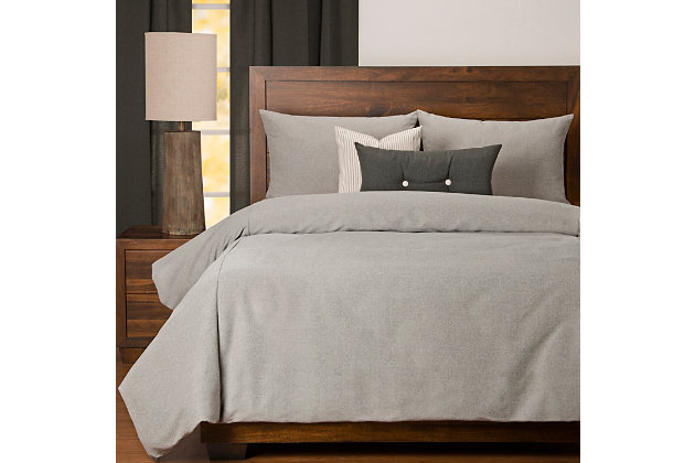 The neutral gray featured on this six-piece luxury duvet cover set will add contemporary style to your bedroom. Soft to the touch and completely stain resistant, this bedding is made with upcycled fibers without chemical treatments making it easy on the environment. Stuffed with a medium-weight fill made from recycled plastic bottles, this cozy comforter benefits your health and the environment when compared to natural down. Life is messy, but paw prints, juice spills and even permanent marker will disappear. This beautiful high end bedding is made to last.Set includes king comforter, inside duvet cover, 2 shams and 2 decorative pillows | Made of polyester | Eco-friendly down alternative fill | Stain resistant | King shams and duvet with zipper closure | Comforter with 8 button closure | Made in USA | Machine washable and bleach safe