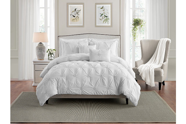 Transform the look of your master bedroom with this stylish ultra plush floral pintuck comforter set. Hand stitched floral details and offered in an array of fashionable colors, this set not only looks good, but feels great. Experience sleep like never before with our double brushed microfiber and hypoallergenic filling crafted comforter set.Unique hand stitched floral details that stylishly adorn contemporary bedrooms | Double brushed microfiber creates the finest and softest hand | Made up of hypoallergenic materials, great for those with allergies and other sensitivities | Wrinkle resistant and colorfast for enduring use | Easy to care, machine washable