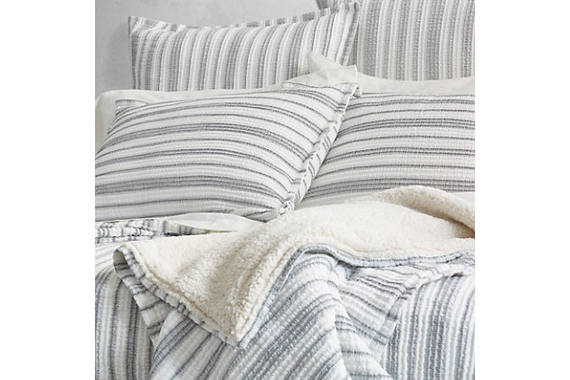 Crafted in Portugal from exceptionally fine 100% Cotton yarns, the Coachella Throw offers Malibu Beach House inspired indulgence and incredible comfort. Featuring a heavyweight construction, this plush throw blanket is uniquely woven with a soft crinkled textured in white and grey stripes with a warm Sherpa reverse. Add this stylish plush throw as a gorgeous neutral layer to your sofa or with the Coachella collection to complete the look.Cotton features unique insulation properties that keeps you warm in the Winter, and breathability to keep you cool in the Summer | Yarns are of the highest quality, combed, long staples, providing long lasting comfort and durability | White Sand linens are crafted with a high level of complexity and detail, and embrace distinct Portuguese weaving looms that are a mastery of many generations | White Sand products are covered by OEKOTEX STANDARD 100 CLASS I, guaranteeing chemical-free environmentally friendly materials and packaging | 100% Cotton | Imported