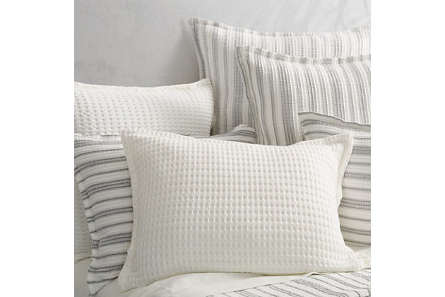 Crafted in Portugal from exceptionally fine 100% Cotton yarns, the Pebble Beach Pillow Sham adds relaxed versatility and effortless layering to your decor. Thoughtfully textured with a honeycomb weave and a lightweight luster. Garment dyed in an array of essential shades such as white, navy, sand, and stone for a tasteful touch of dimension to your sleep space, and coordinates beautifully with the Pebble Beach Throw and White Sand collection.Cotton features unique insulation properties that keeps you warm in the Winter, and breathability to keep you cool in the Summer | Yarns are of the highest quality, combed, long staples, providing long lasting comfort and durability | White Sand linens are crafted with a high level of complexity and detail, and embrace distinct Portuguese weaving looms that are a mastery of many generations | White Sand products are covered by OEKOTEX STANDARD 100 CLASS I, guaranteeing chemical-free environmentally friendly materials and packaging | 100% Cotton | Imported