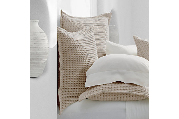 Crafted in Portugal from exceptionally fine 100% Cotton yarns, the Pebble Beach Euro Sham adds relaxed versatility and effortless layering to your decor. Thoughtfully textured with a honeycomb weave and a lightweight luster. Garment dyed in an array of essential shades such as white, navy, sand, and stone for a tasteful touch of dimension to your sleep space, and coordinates beautifully with the Pebble Beach Throw and White Sand collection.Cotton features unique insulation properties that keeps you warm in the Winter, and breathability to keep you cool in the Summer | Yarns are of the highest quality, combed, long staples, providing long lasting comfort and durability | White Sand linens are crafted with a high level of complexity and detail, and embrace distinct Portuguese weaving looms that are a mastery of many generations | White Sand products are covered by OEKOTEX STANDARD 100 CLASS I, guaranteeing chemical-free environmentally friendly materials and packaging | 100% Cotton | Imported