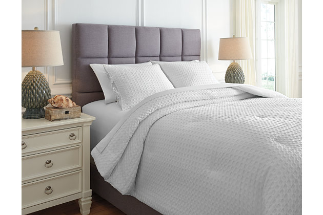 Give your bedroom that upscale hotel look and feel with the Maurilio queen comforter set. Simply striking in crisp and clean white, this comforter set’s percale cotton cover sports a chic textural design for added oomph.Set includes comforter and 2 pillow shams | Cotton percale cover | Polyester fill | Imported | Machine washable