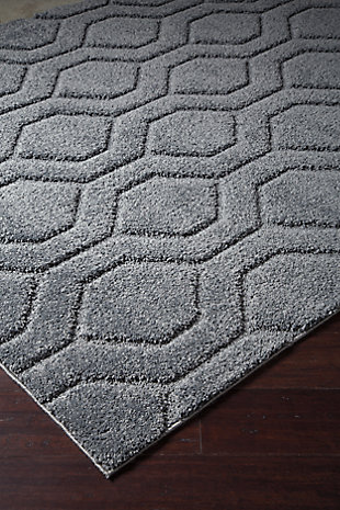 Let cool, contemporary style take shape with the simply striking Matthew area rug. Its titanium gray shade is on trend and upscale. Hexagon pattern adds just enough depth and interest.Made of polypropylene | Machine tufted | 6mm pile | Latex backing | Rug pad recommended | Spot clean only | Made in USA