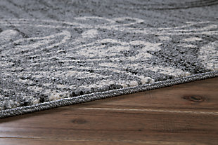 Sporting an on-trend erased motif effect, the Verrill area rug merges the best of old and new. Classic medallion pattern and gray, black and cream palette set the scene for easy-elegant style. Made of polypropylene | Machine woven | 8mm pile | Jute backing | Rug pad recommended | Spot clean | Imported