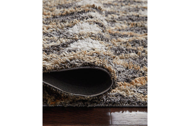 The Vinmore accent rug features a mix of design and color that is sure to breathe life into any room in your home. The tan and gray palette serves up a striking, eye catching aesthetic that is sure to be the focal point in your space.Made of polyester | Hand tufted | 12mm pile | Cotton backing | Rug pad recommended | Spot clean only | Imported