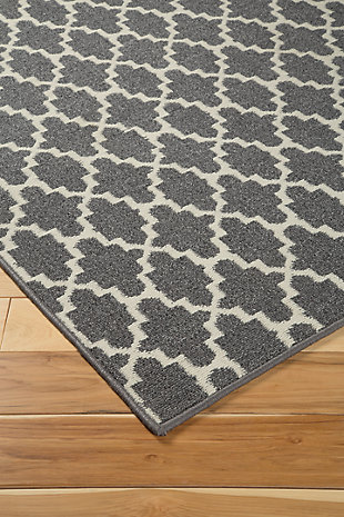 The Nathanael accent rug places high style and utility into full view. Its gray and cream gate pattern aesthetically pleases while adding a touch of exotic flair to your space. Rest assured, the durable polypropylene is equipped to withstand the tests of time.Machine tufted | Made of polypropylene | 7mm pile | Latex backing | Rug pad recommended | Imported | Spot clean