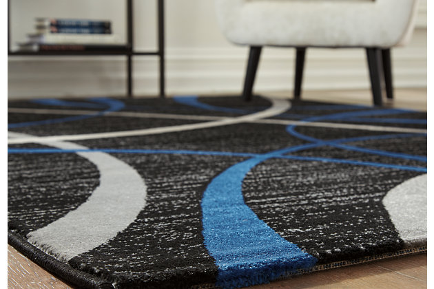 Pairing shapely swirls with bold and brilliant swashes of color, the Jenue area rug is the ultra-contemporary statement piece you’ve been longing for. Rich palette of black, gray and blue is loaded with depth and tonal interest.Made of polypropylene | Machine woven | 8mm pile | Jute backing | Imported | Rug pad recommended | Spot clean only