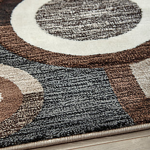 Talk about bringing modern pop to a space. With its multilayered geometric design and pleasing palette of black, brown and cream tones, the Guintte area rug is decidedly bold without coming on too strong.Made of polypropylene | Machine woven | 12mm pile | Jute backing | Rug pad recommended | Spot clean only | Imported