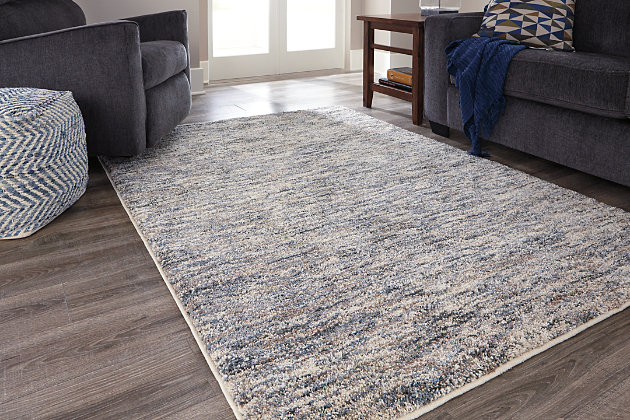 Neutral-ize your space in a richly refined way with this multi-tonal accent rug. Variegated design in shades of tan, blue and cream is simply spectacular.Made of polypropylene | Machine woven | 28mm pile | Rug pad recommended | Spot clean only | Made in USA