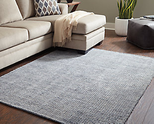 Make a simple, striking statement with the Jonay area rug. A high/low textural grid design gives so much dimension to the rug’s soft and subtle palette with cream and shades of blue.Made with polyester and viscose | Handwoven | 7mm pile | Cotton backing | Rug pad recommended | Spot clean only | Imported