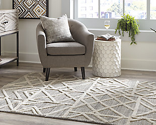 Dynamic geometric shapes coupled with subtle neutral colors communicate sophistication even when underfoot. The Karah area rug works as well in a transitional suburban space as it does in an ultra-modern loft. Sink your toes into something more cosmopolitan.Made of wool | Handwoven | 12mm pile | Cotton backing | Rug pad recommended | Spot clean only | Imported