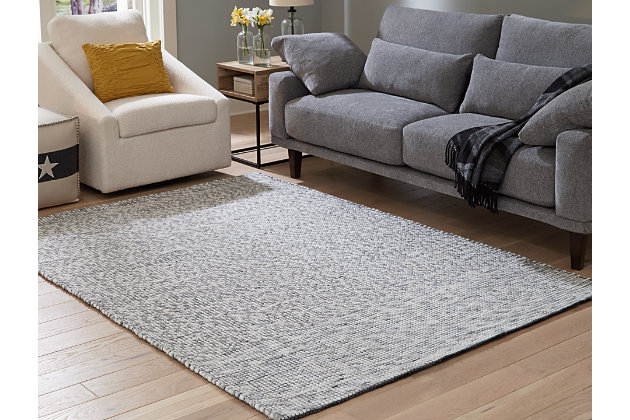 For a clean and cool modern look, cover your floor with the Jonalyn area rug. A raised stitched rug, this floor covering offers casual style in an easy way with a white, gray and charcoal palette designed to fit into many interiors.Made of wool/viscose blend | Handwoven | No pile | Cotton backing | Rug pad recommended | Spot clean only | Imported