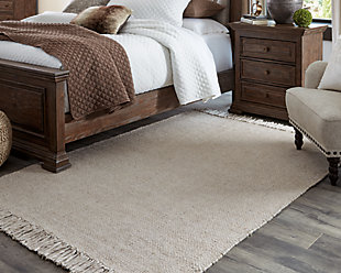 For an unassuming modern look, cover your floor with the Mariano area rug. With a soft, solid beige pallet, this floor covering offers casual style in an easy way designed to fit into many interiors.Made of polyester | Handwoven | Fringe edge | No pile | No backing; rug pad recommended | Spot clean only | Imported