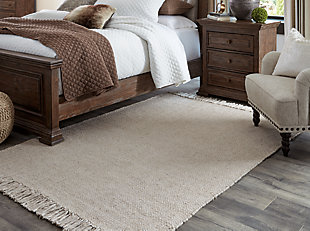 For an unassuming modern look, cover your floor with the Mariano area rug. With a soft, solid beige pallet, this floor covering offers casual style in an easy way designed to fit into many interiors.Made of polyester | Handwoven | Fringe edge | No pile | No backing; rug pad recommended | Spot clean only | Imported