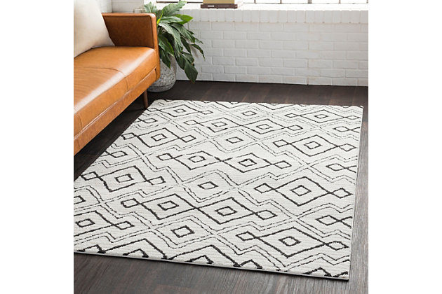 Simply timeless and beautifully on trend, this masterfully crafted moroccan style area rug is dressed to impress. Easy elegant and casually cool, it looks right at home whether your furnishings are classic or contemporary.Made of polyester and polypropylene | Machine woven | High pile | No backing; rug pad recommended | Spot clean | Imported