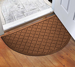 From the front entry to the back door, the Aqua Shield half round doormat provides a whole lot of peace of mind.  Beyond scraping dirt from shoes and paws, it’s got an exclusive “water dam” design for unbeatable absorbency. Resistant to the most extreme weather elements, this indoor-outdoor doormat is certified slip resistant by the National Floor Safety Institute. Talk about one heck of a welcome mat.100% polypropylene face is anti-static, quick drying and resistant to the most extreme weather elements, including intense sunlight | Synthetic rubber underside is certified slip-resistant by the national floor safety institute | Permanently molded design will not crush, mildew, mold, or rot | Exclusive 'water dam' raised border helps keep dirt and water in the mat, not on your floor | Aqua shield absorbs water and scrapes mud and dirt from shoes and paws to keep your entryway clean and dry | Absorbs 1 gallon of water per square yard | Suitable for indoor/outdoor use | Vacuum or hose clean, then hang to dry | Synthetic rubber backing is made with 25% recycled rubber | Made in the u.s.a.
