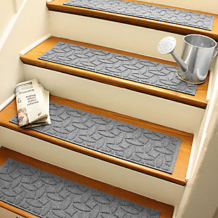 Step up to a higher level of comfort, safety and quality with this set of four Aqua Shield stair treads. Beyond scraping dirt from shoes and paws, these stylish stair treads have an exclusive “water dam” design for unbeatable absorbency. Resistant to the most extreme weather elements, they're certified slip resistant by the National Floor Safety Institute—making them the ultimate way to go inside and out!Set of 4 | 100% polypropylene face is anti-static, quick drying and resistant to the most extreme weather elements, including intense sunlight | Synthetic rubber underside keeps stair treads in place though stair tread installation tape is highly recommended | Permanently molded design will not crush mildew, mold, or rot | Low-profile design allows door to swing over the treads without catching | Suitable for indoor/outdoor use | Sweep, vacuum or hose clean | Skid-resistant synthetic rubber backing is made with 25% recycled rubber | Made in the u.s.a.