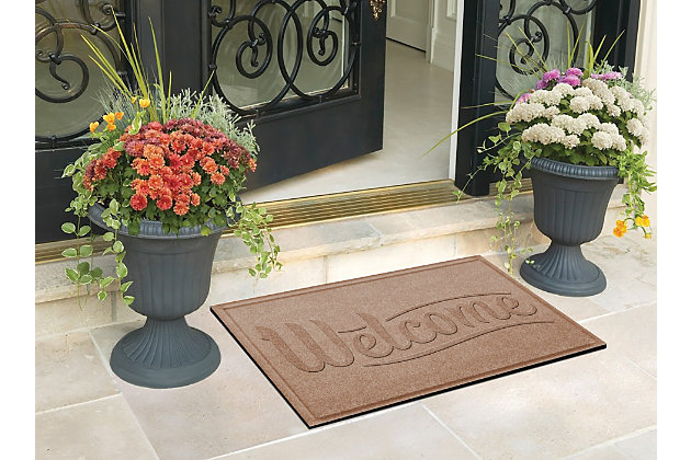 Say goodbye to tracked-in water and dirt and hello to high performance with the Aqua Shield doormat. Beyond scraping dirt from shoes and paws, this welcoming doormat has an exclusive “water dam” design for unbeatable absorbency. Resistant to the most extreme weather elements, this doormat is certified slip resistant by the National Floor Safety Institute—making it the ultimate way to go inside and out!100% polypropylene face is anti-static, quick drying and resistant to the most extreme weather elements, including intense sunlight | Synthetic rubber underside is certified slip-resistant by the national floor safety institute | Permanently molded design will not crush mildew, mold, or rot | Exclusive 'water dam' raised border helps keep dirt and water in the mat, not on your floor | Aqua shield absorbs water and scrapes mud and dirt from shoes and paws to keep your entryway clean and dry | Absorbs 1 gallon of water per square yard | Suitable for indoor/outdoor use | Vacuum or hose clean, then hang to dry | Synthetic rubber backing is made with 25% recycled rubber | Made in the u.s.a.