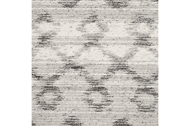If tribal-inspired textiles speak to you, this alluring area rug is sure to translate beautifully in your space. With its soothing hues and overdyed effect, it's subtle yet so striking.Made of polypropylene | Medium pile | Rug pad recommended | Power loomed/machine made | Imported | Spot clean
