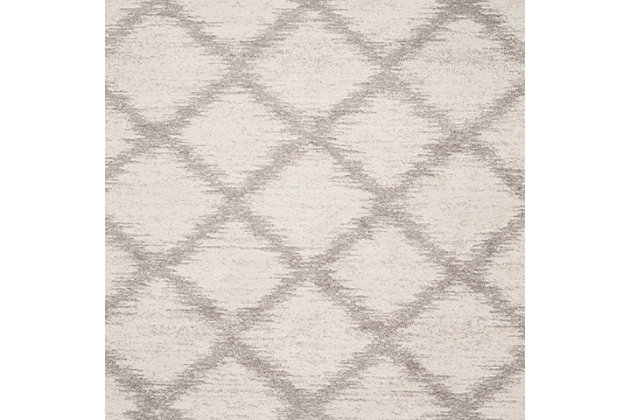 With its timeless trellis pattern design, this easy-elegant area rug is right on trend. Whether your style is contemporary or classic, its simply chic aesthetic goes with the flow.Made of  polypropylene | Machine woven | Medium pile | No backing; rug pad recommended | Spot clean | Imported