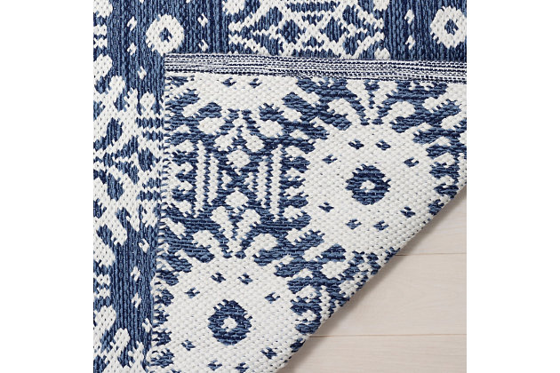 What a footloose and fancy-free feeling this rug brings to your living space. Boho-chic rug is cool and creative. Handmade craftsmanship and intricate patterns add a strikingly exotic aesthetic to your space.Made of cotton and polyester | Handmade | Low profile | No backing; rug pad recommended | Spot clean | Imported