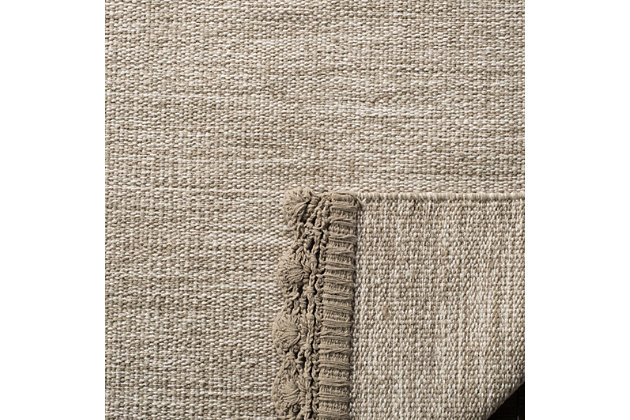 Double up on comfort and style with this easy-breezy area rug. Flatweave design infuses a casually cool element that feels right at home. Ends are finished with a crocheted edge for vintage-chic appeal.Made of cotton | Handmade | Low profile | No backing; rug pad recommended | Spot clean | Imported