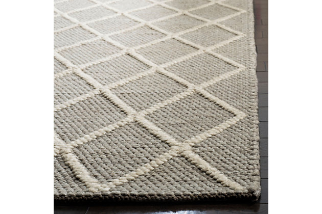 With its timeless trellis pattern design, this easy-elegant area rug is right on trend. Whether your style is contemporary or classic, its simply chic aesthetic goes with the flow.Made of bamboo silk and wool | Handmade | Low profile | Cotton backing; rug pad recommended | Spot clean | Imported