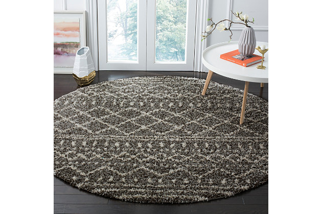 Indulge in retro revival with this sumptuous shag rug with subtle tribal design. Plush pile is loaded with fun, feel-good texture. Harmonious hues make it a tasteful choice for so many spaces.Made of  polypropylene | Machine woven | Medium pile | No backing; rug pad recommended | Spot clean | Imported