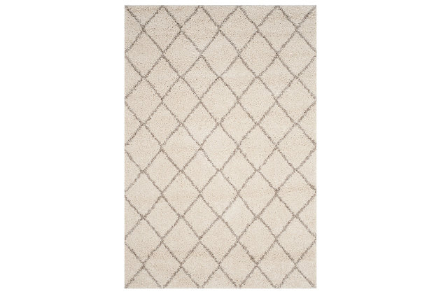 Indulge in retro revival with this sumptuous shag rug with subtle geometric design. Plush pile is loaded with fun, feel-good texture. Harmonious hues make it a tasteful choice for so many spaces.Made of  polypropylene | Machine woven | Medium pile | No backing; rug pad recommended | Spot clean | Imported