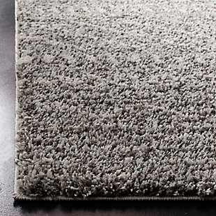 Indulge in retro revival with this sumptuous shag rug with subtle geometric design. Plush pile is loaded with fun, feel-good texture. Harmonious hues make it a tasteful choice for so many spaces.Made of  polypropylene | Machine woven | Medium pile | No backing; rug pad recommended | Spot clean | Imported
