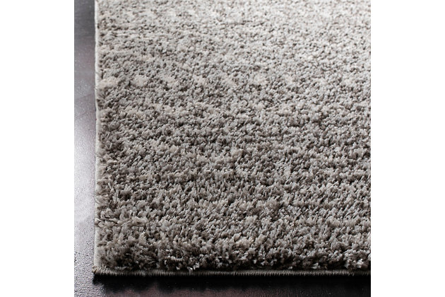 Indulge in retro revival with this sumptuous shag rug with subtle geometric design. Plush pile is loaded with fun, feel-good texture. Harmonious hues make it a tasteful choice for so many spaces.Made of polypropylene | Machine woven |  pile | No bac; rug pad recommended | Spot clean | Imported