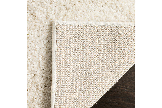 Indulge in retro revival with this sumptuous shag rug. Plush pile is loaded with fun, feel-good texture. Harmonious hues make it a tasteful choice for so many spaces.Made of polypropylene | Machine woven |  pile | No bac; rug pad recommended | Spot clean | Imported