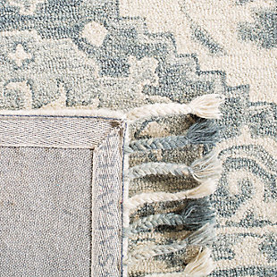 Merging symmetry with an organic sense of flow, this rug is out of this world in terms of tone and texture. Classic border design provides such rich shade variation, taking your floors to a whole new level.Made of wool | Handmade | Low pile | Cotton backing; rug pad recommended | Spot clean | Imported