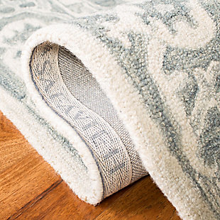 Merging symmetry with an organic sense of flow, this rug is out of this world in terms of tone and texture. Classic border design provides such rich shade variation, taking your floors to a whole new level.Made of wool | Handmade | Low pile | Cotton backing; rug pad recommended | Spot clean | Imported