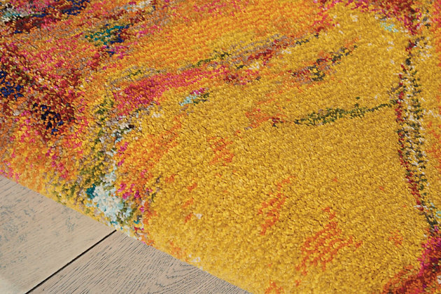 Why play it safe, when you can transform a space with big, bold and brilliant color? Saturated with deep, dramatic hues, this designer area rug stands out from the crowd for all the right reasons.Made of polypropylene | Machine woven | Latex backing; rug pad recommended | Imported | Spot clean
