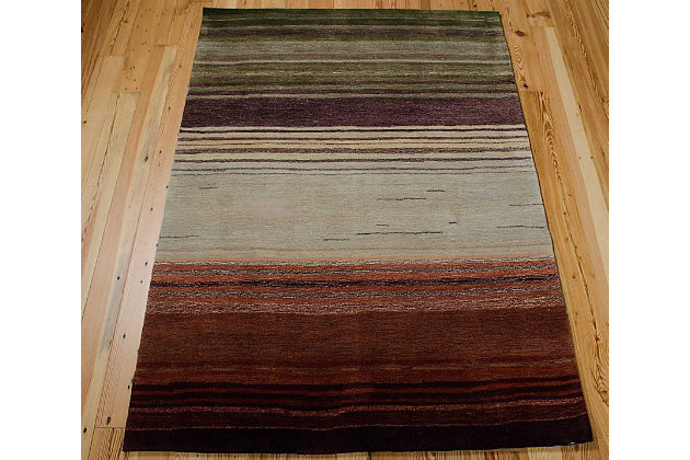 With its perfectly imperfect stripes and bold, brilliant color palette, this hand-tufted area rug makes a simply striking statement. You’re sure to love how it aligns your space in a decidedly modern way.Made of polyester | Hand-tufted | Latex/cotton backing; rug pad recommended | Hand-carved accents | Imported | Spot clean