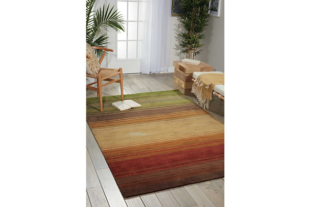 With its perfectly imperfect stripes and bold, brilliant color palette, this hand-tufted area rug makes a simply striking statement. You’re sure to love how it aligns your space in a decidedly modern way.Made of polyester | Hand-tufted | Latex/cotton backing; rug pad recommended | Hand-carved accents | Imported | Spot clean