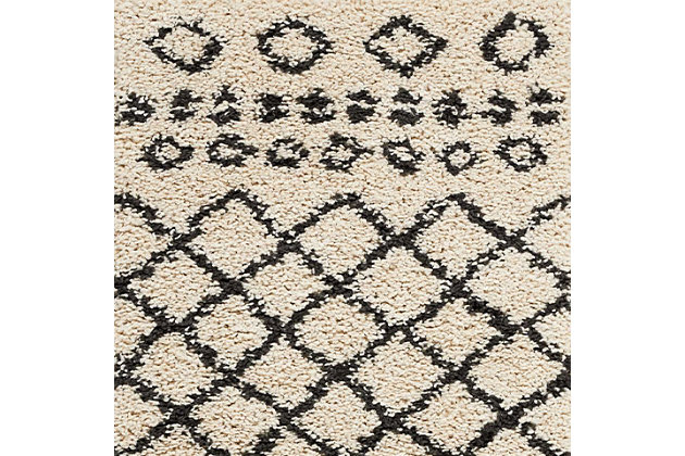 Simply timeless and beautifully on trend, this masterfully crafted moroccan style area rug is dressed to impress. Easy elegant and casually cool, it looks right at home whether your furnishings are retro, boho or somewhere in between.Made of polypropylene | Machine woven | Shag pile, low shedding | Imported | Spot clean