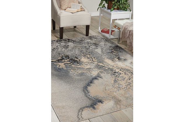 Striking abstract patterned rug leaves so much to the imagination. Its ethereal design dresses up a room with glamourously gradated shades, visual texture and a highly contemporary point of view.Made of polyester | Machine woven | Cut pile, low shedding | Latex backing | Imported | Spot clean