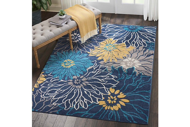 Loo to liven a room? This designer area rug provides the fresh take on floral you've been longing for. Its flowing pattern and organic hues exude a sense of ease that’s easy to love.Made of polpropylene | Machine woven | Cut pile, low shedding | Jute bac | Imported | Spot clean